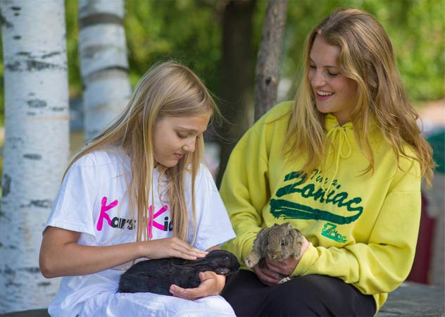 Girls with bunnies at TheZone camp sponsored by Kars4kids